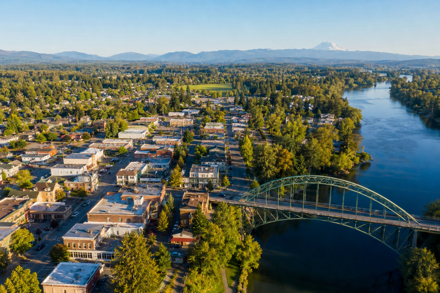 electrician-snohomish-wa-snohomish-river-aerial-view. Aerial view of downtown Snohomish, WA with the Snohomish River and surrounding neighborhoods, showcasing local homes and businesses in Snohomish County.
